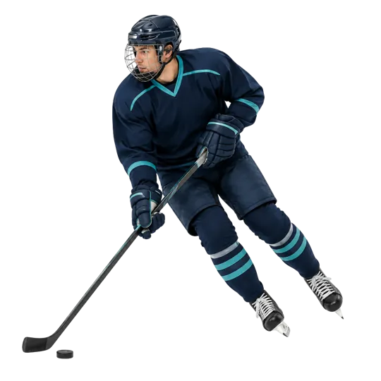 Hockey player skating with a puck in navy and teal equipment